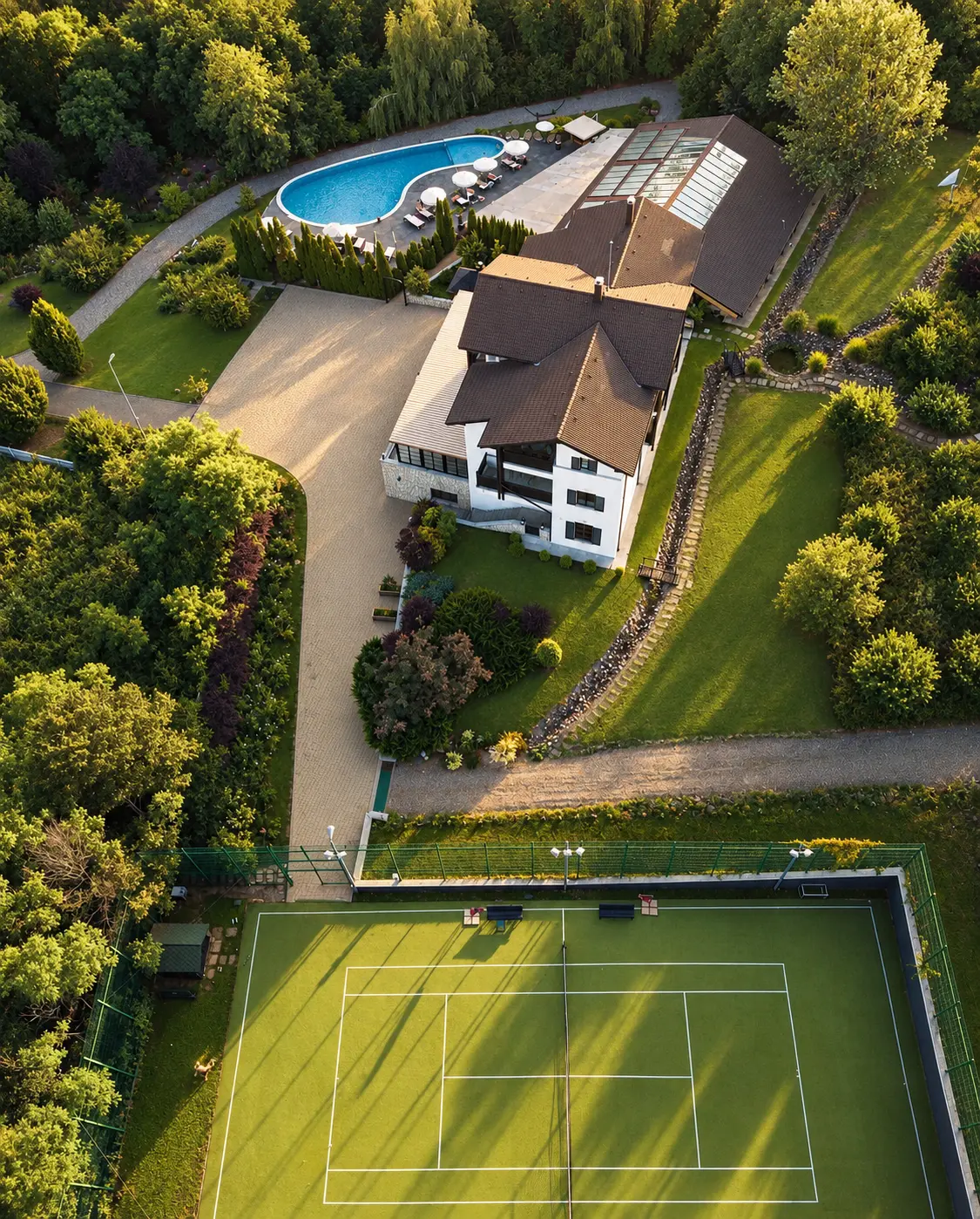 Aerial view of the manor, pool and tennis court