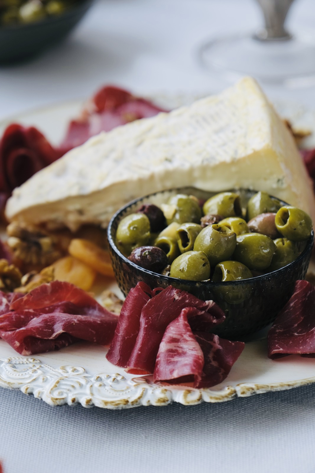 A platter of cheese, olives and cured meat at Manoria